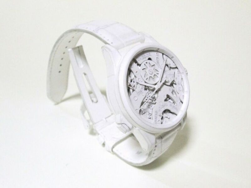 White watch with intricate mechanical details and a white strap.