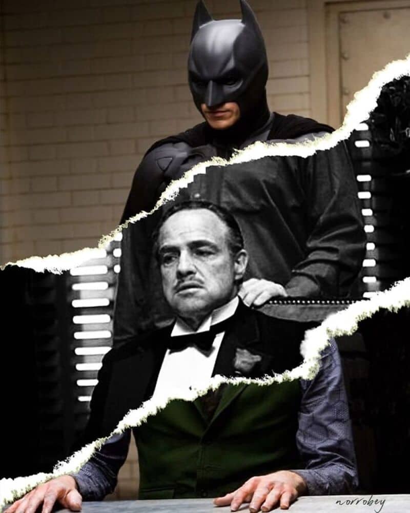 Batman behind a torn paper revealing Marlon Brando as Vito Corleone.