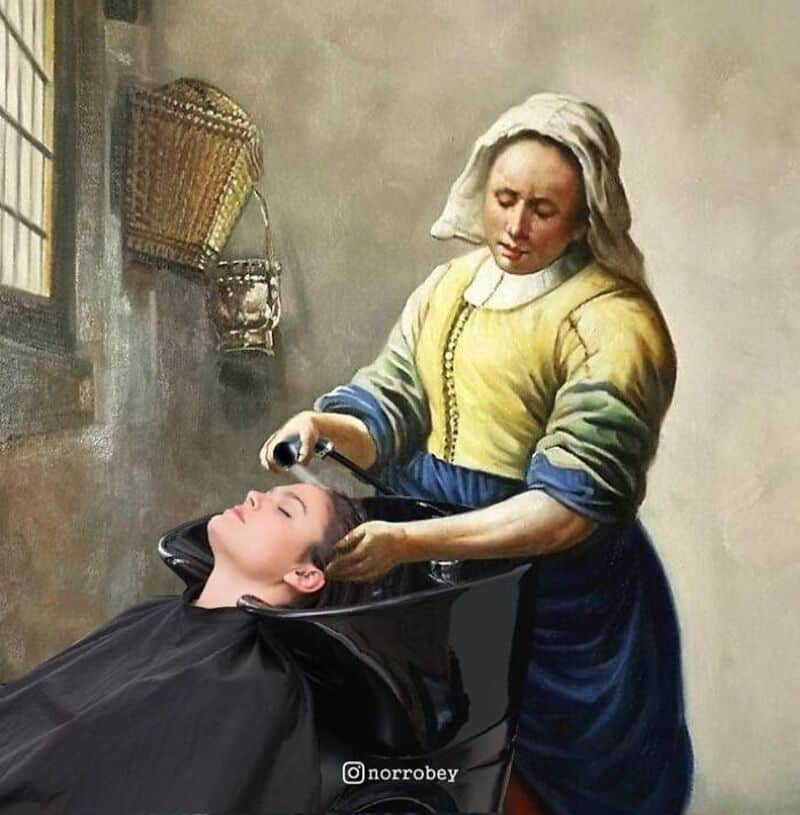 Woman washing a young girl's hair in a vintage-style setting.