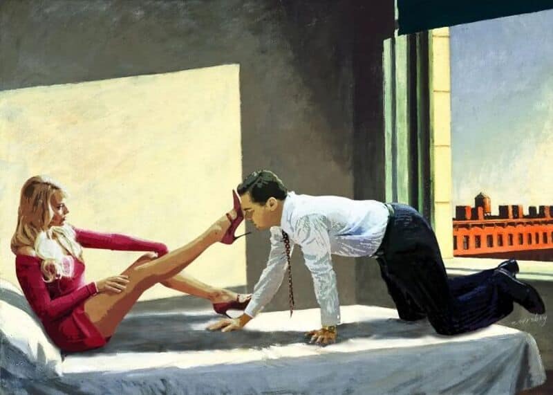 A man on hands and knees on a bed, touching foreheads with a woman sitting with legs extended.