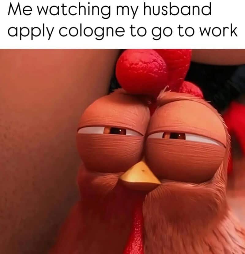 Me watching my husband apply cologne to go to work.