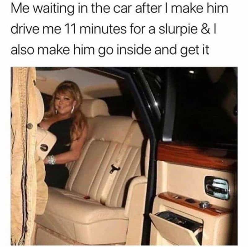 Woman sitting in luxury car, waiting after making him drive 11 minutes for a slurpie.