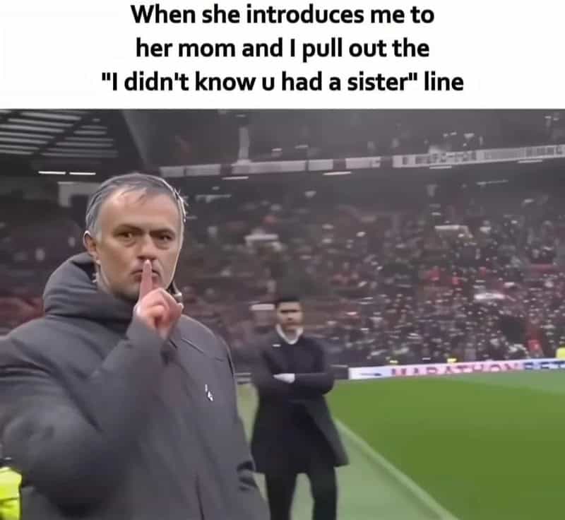 Man shushing with finger on lips, stadium background, meme text about introducing to her mom.