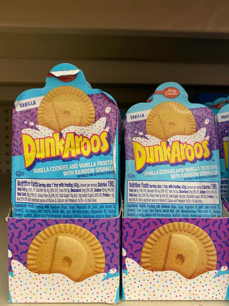 DunkAroos vanilla cookies with rainbow sprinkles in colorful packaging.