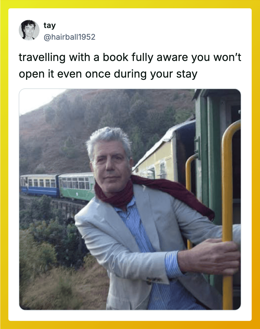 Man on train holding yellow handrail, scenic background, caption about traveling with a book.