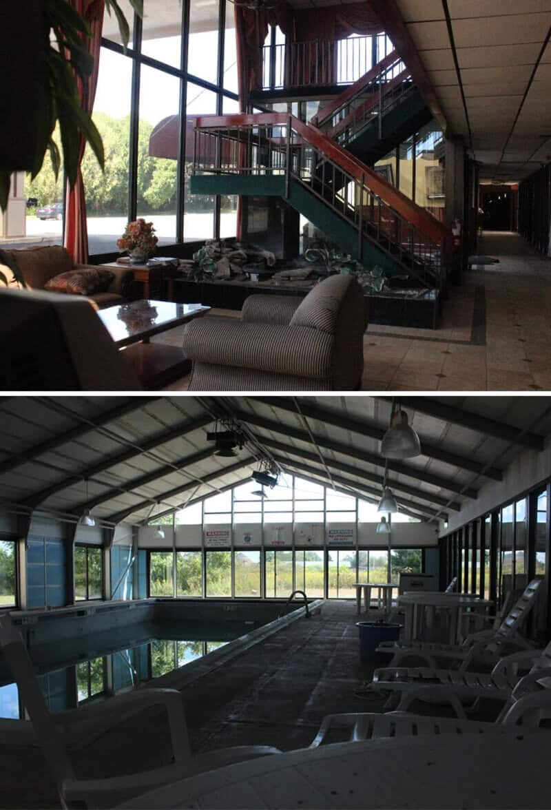 Abandoned indoor pool area with broken furniture and debris.