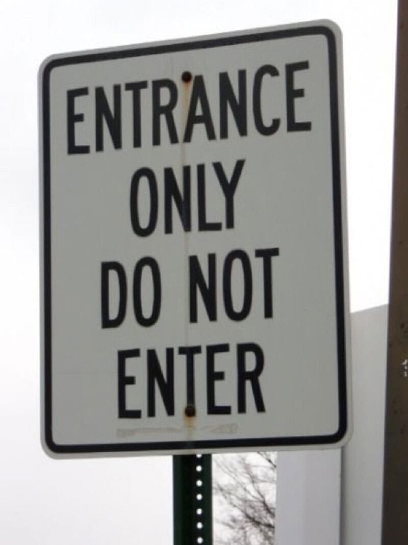 Sign reads 'ENTRANCE ONLY DO NOT ENTER' with a humorous contradiction.