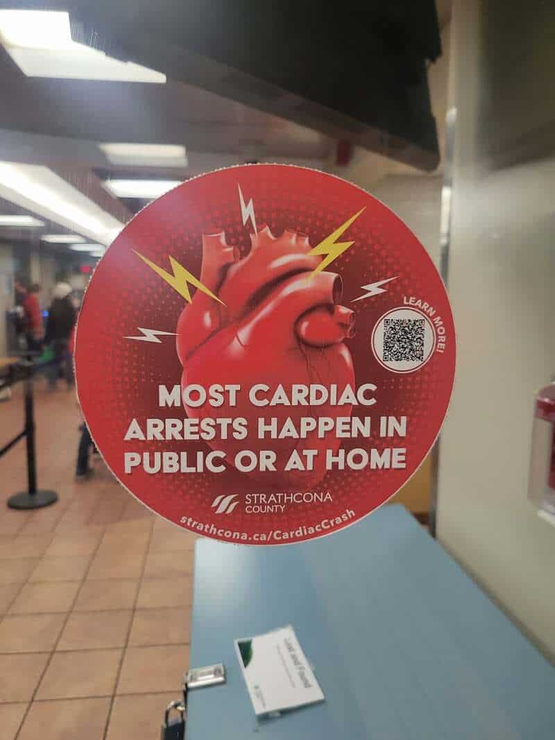 Most cardiac arrests happen in public or at home sign with a heart and lightning bolts.