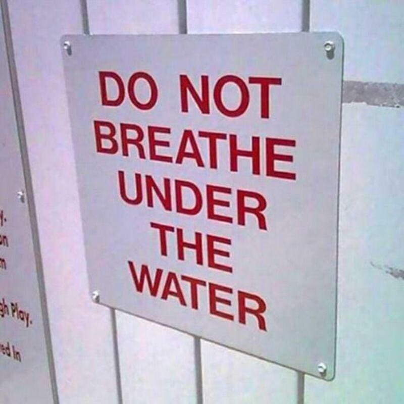 Do not breathe under the water sign in red text.