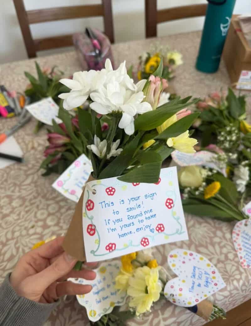 Handmade flower bouquet with a note saying 'This is your sign to smile. If you found me I'm yours to.