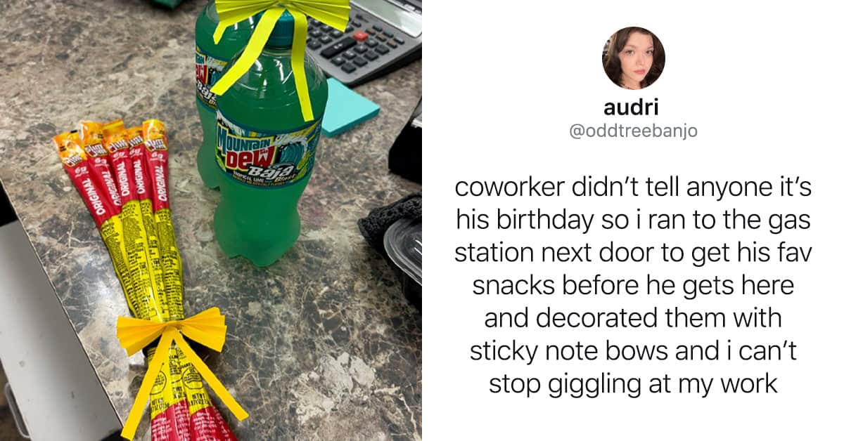 Snacks and a soda on a desk with a sticky note bow.