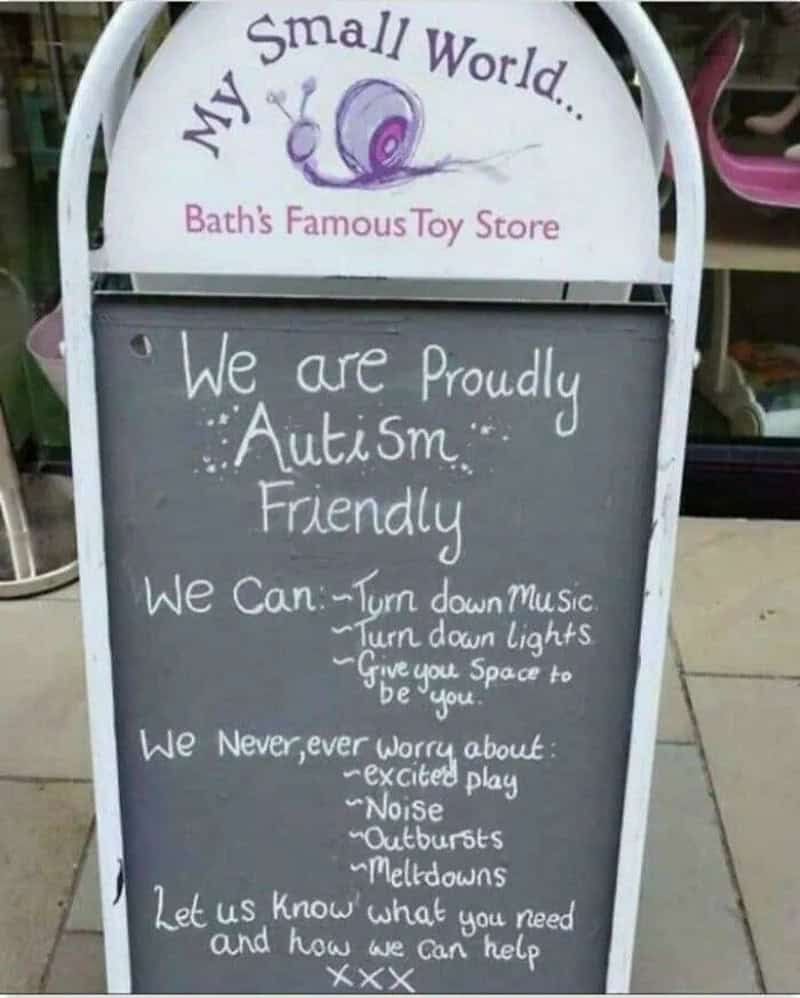 Blackboard sign at Bath's Toy Store promoting autism-friendly features and support.