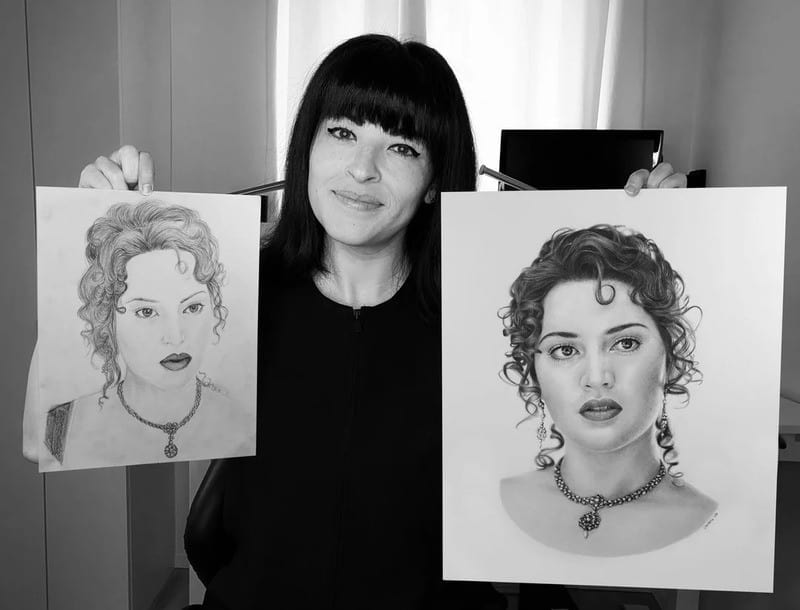 Woman holding two portrait sketches, one of a woman with curly hair and one with straight hair.
