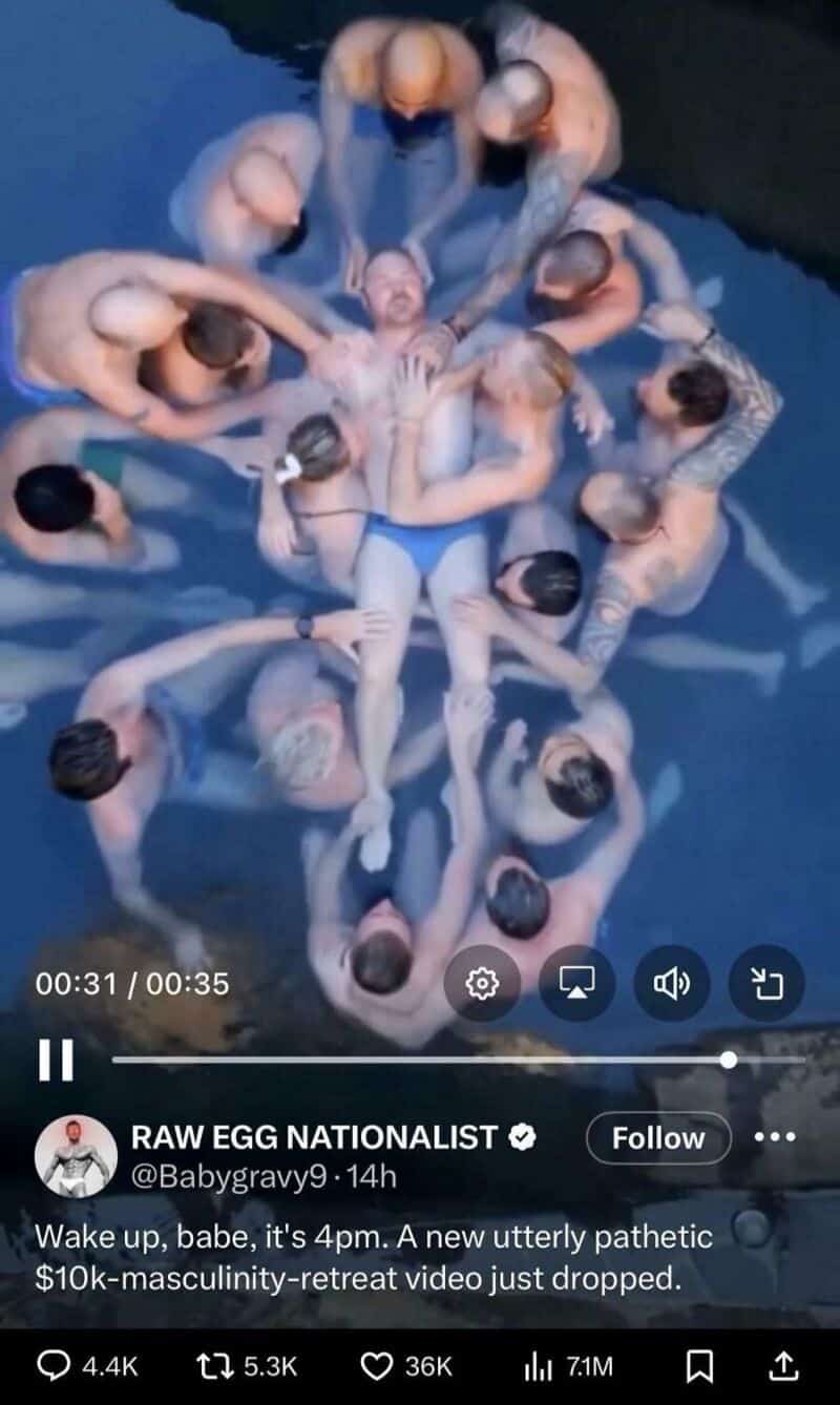 Group of people in a pool forming a star shape around a person in the center.