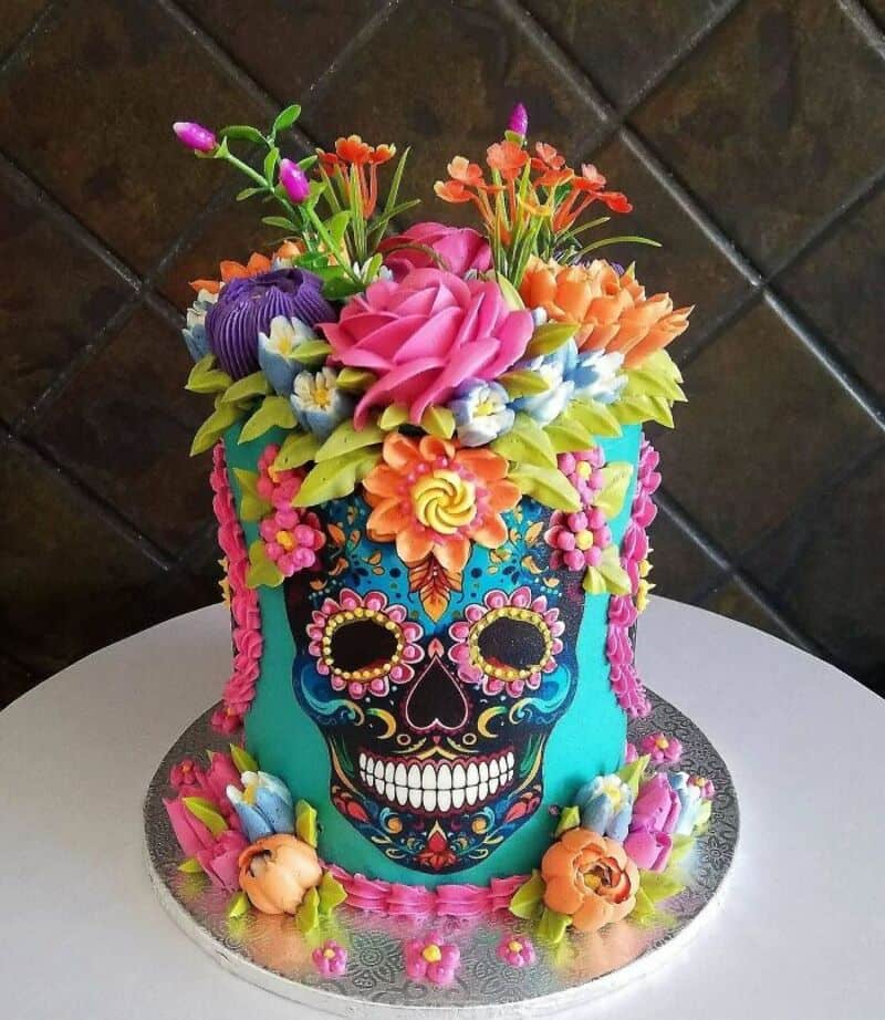 Colorful sugar skull cake with flowers and decorations for bakers.