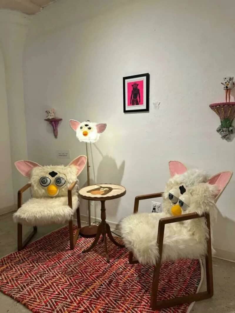 Decorative chairs with animal-themed plush covers and wall art in a cozy room.