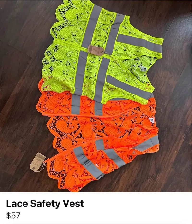 Two neon yellow and two neon orange lace safety vests with reflective strips on a wooden floor.