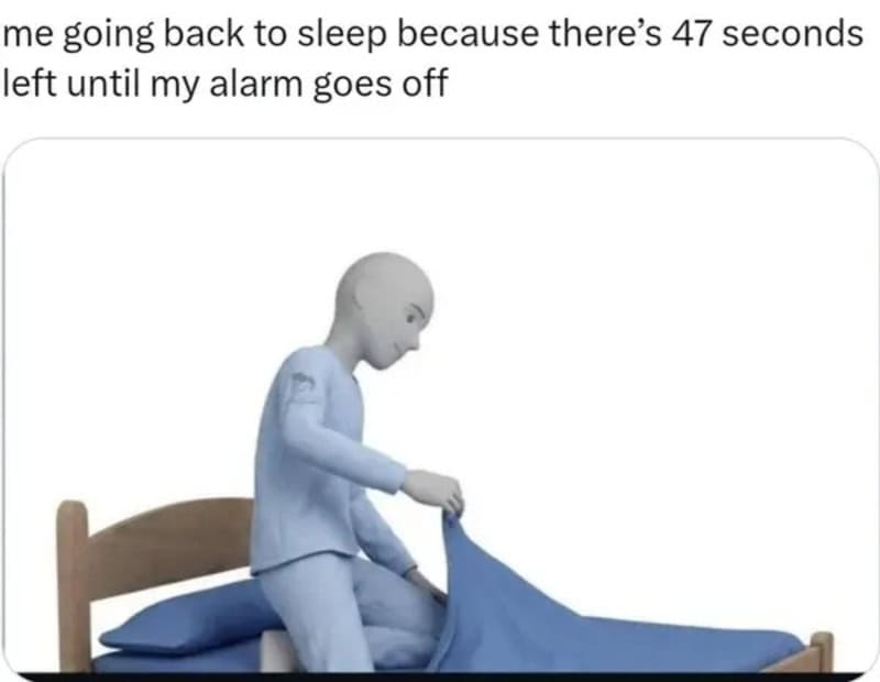 Mannequin in pajamas pulling up a blue blanket on a bed.