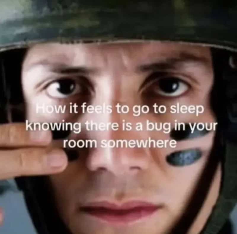 Close-up of a person in a helmet with text about sleep and bugs.