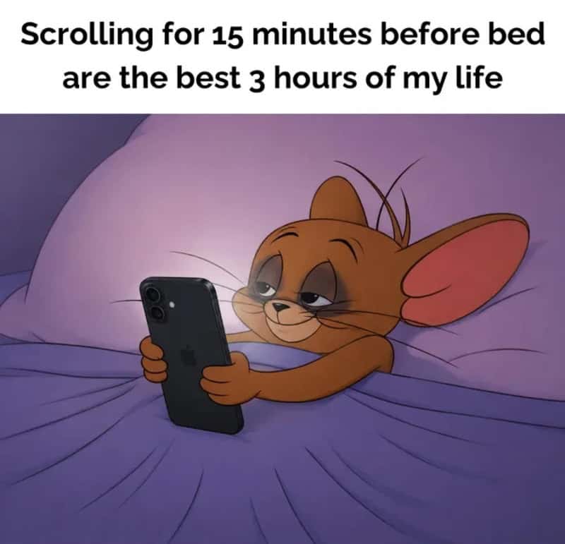 Tom from Tom and Jerry using a phone in bed with the caption about scrolling before bed.