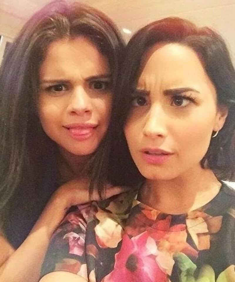 Two women with confused expressions, one with long dark hair and the other with short dark hair.