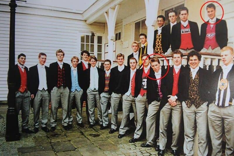 Group of young men in formal attire outside a house, some circled in red.