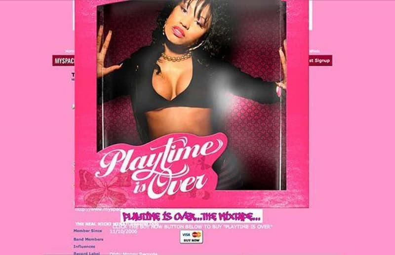 Woman with black hair and choker posing in front of pink background.