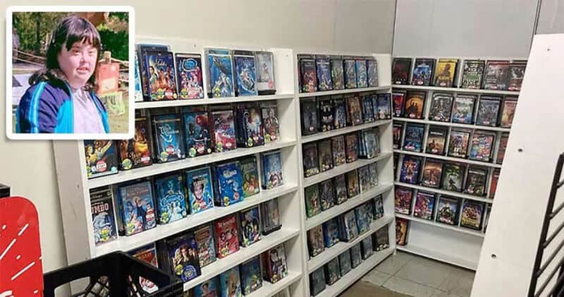 Bookshelves filled with DVDs or video games in a store.