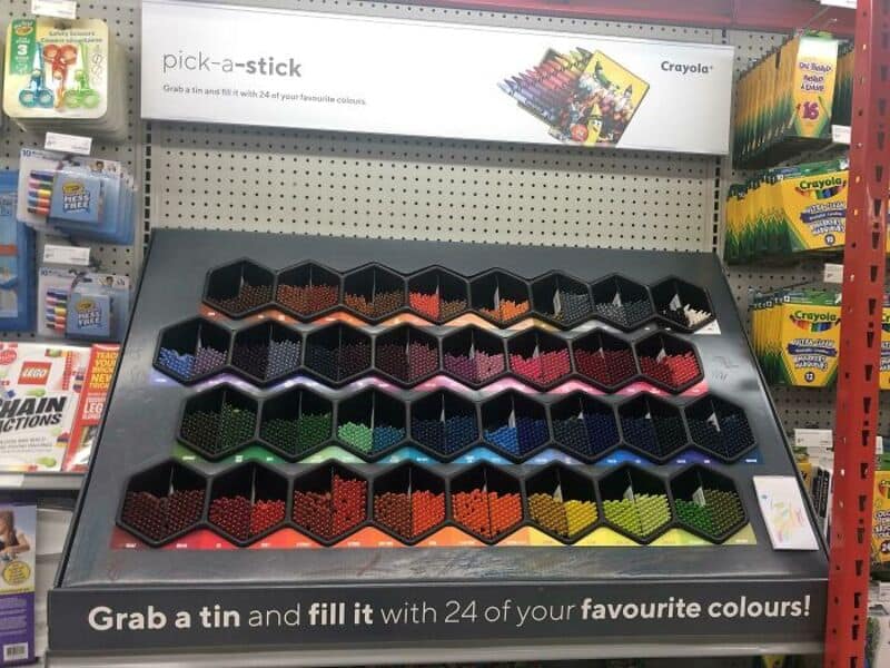 Crayola pick-a-stick display with 24 colorful hexagonal containers.