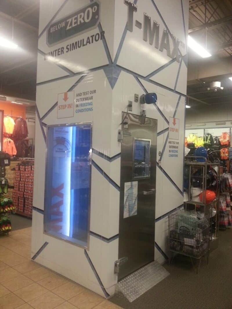 Indoor retail store with a promotional gaming booth for the game 'I-MAX'.