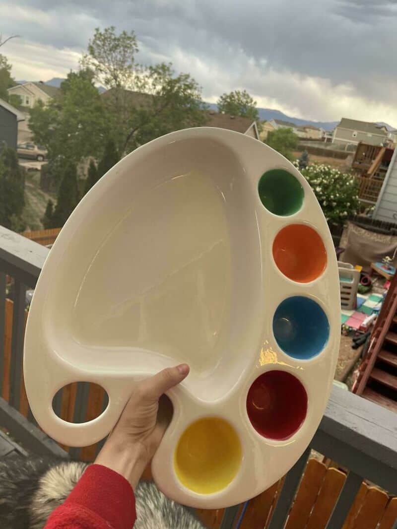Empty artist palette with green, orange, blue, red, and yellow paint wells.