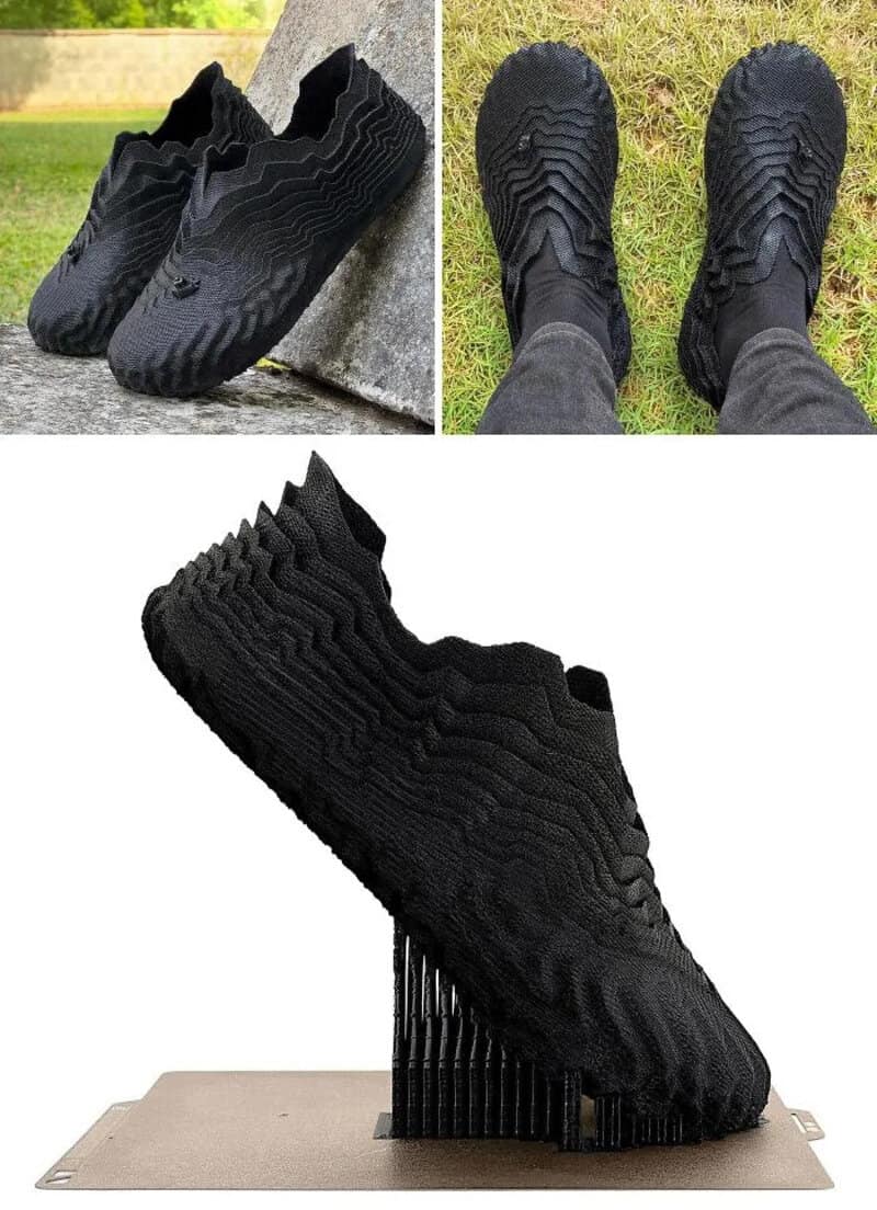 Black 3D-printed shoes with textured surface and unique sole design.