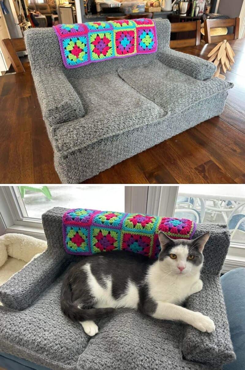Colorful crochet granny squares on a gray sofa with a black and white cat.