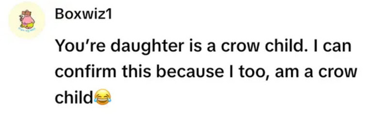 A girl with a crow child, laughing, confirming she is also a crow child.