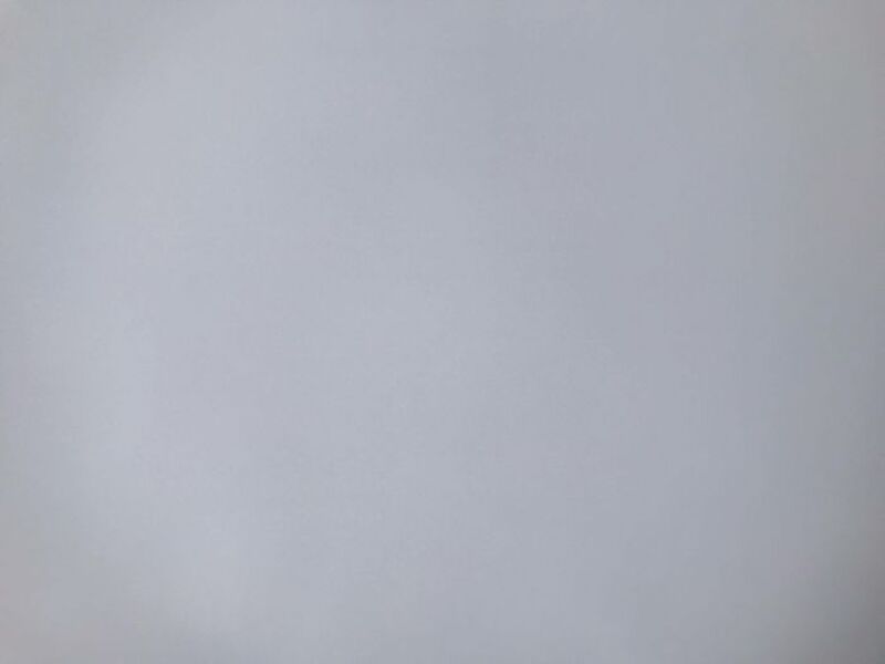 Empty gray wall with no objects or decorations.