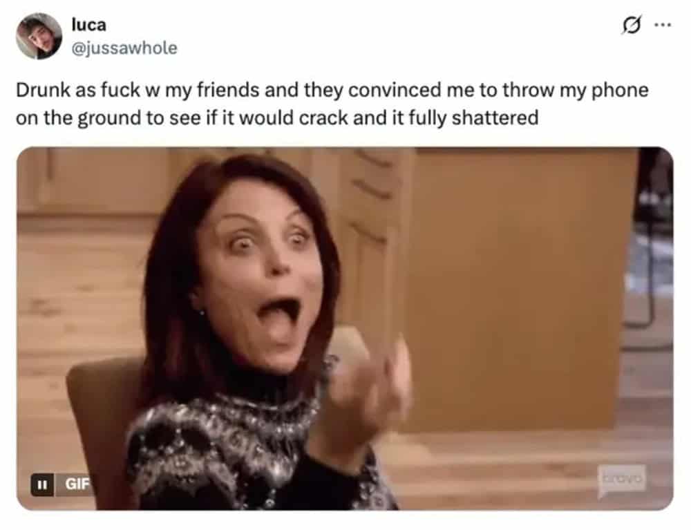 Woman with surprised expression, mouth open, pointing finger, in a room.