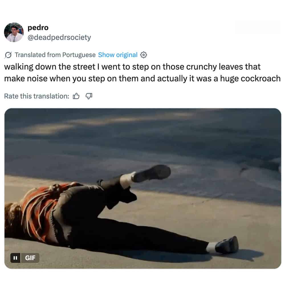 Person falling on the street with a large cockroach nearby.