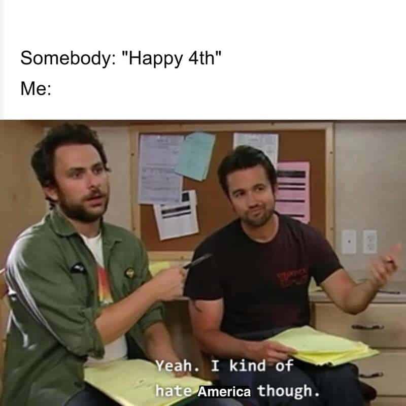 Two men sitting in a room, one holding a pen, with text 'Somebody: "Happy 4th" Me:'.