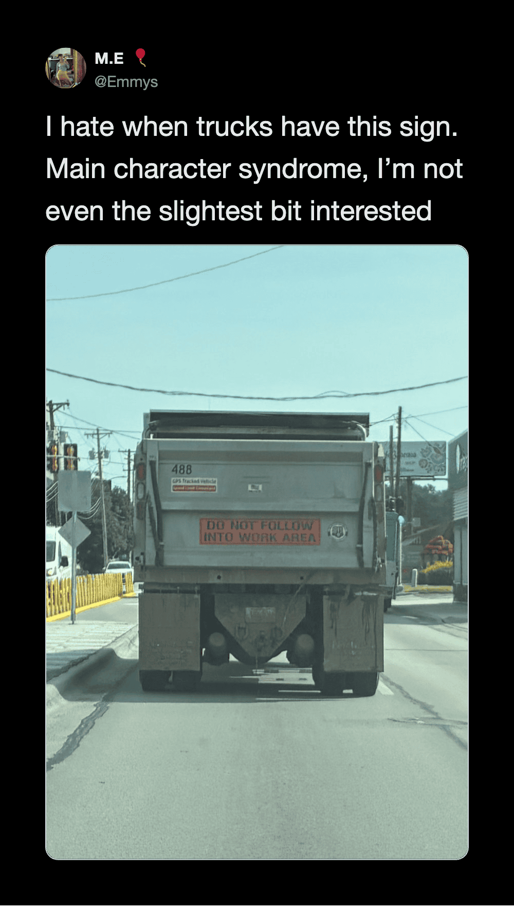 Truck with a sign that says 'DO NOT FOLLOW INTO WORK AREA' on the back.