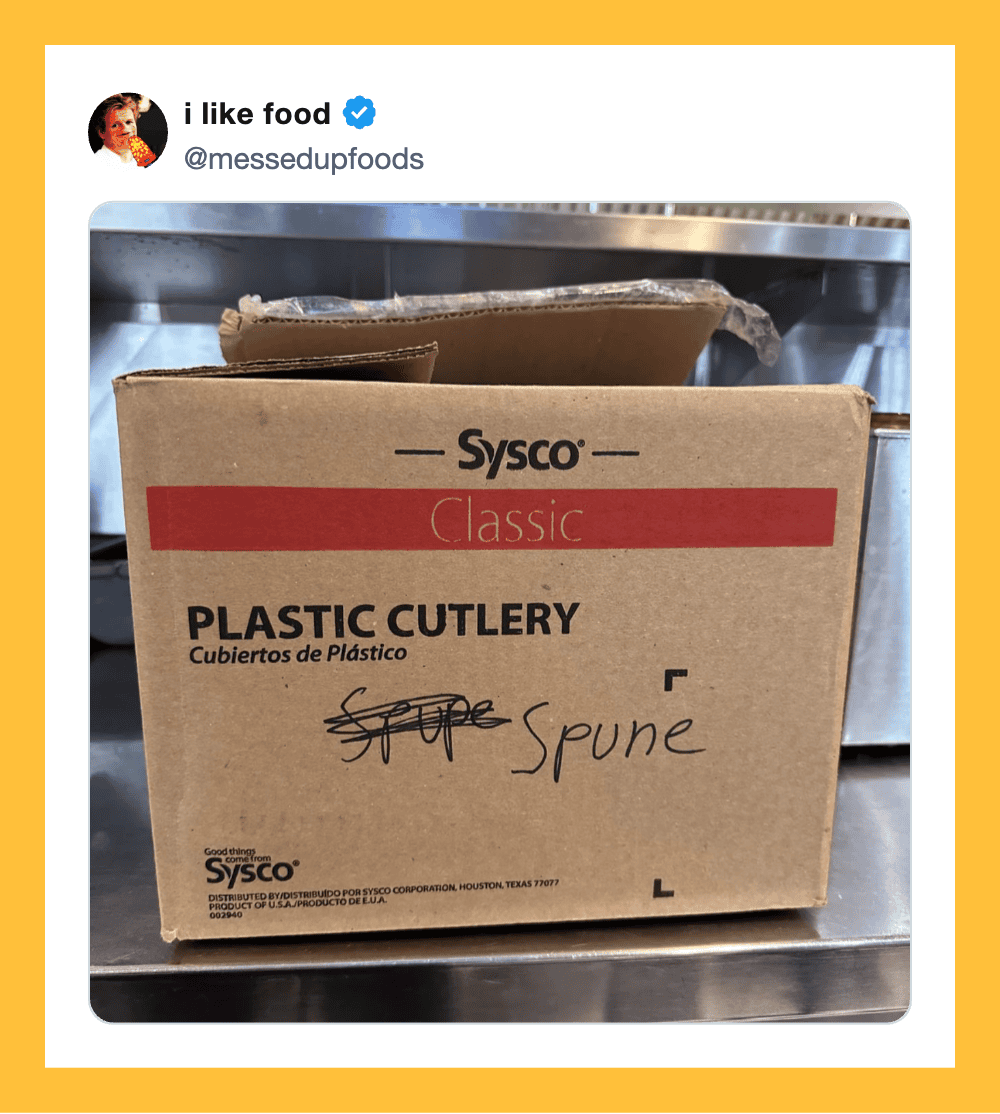 Box of Sysco plastic cutlery with handwritten 'spoon' label on it.