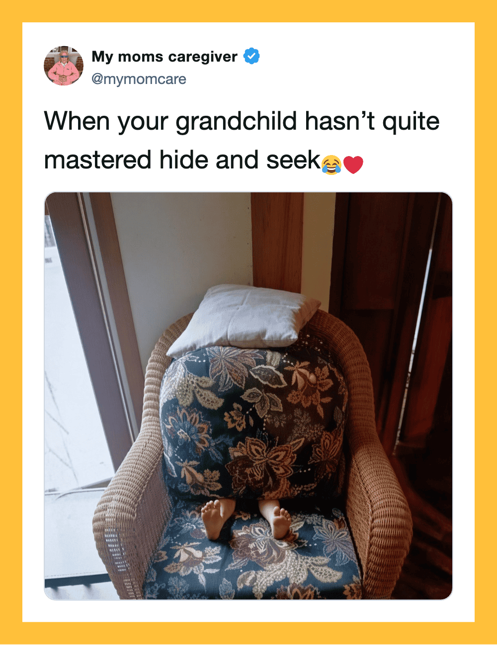 Grandchild's head hidden under pillow on chair, with feet visible.