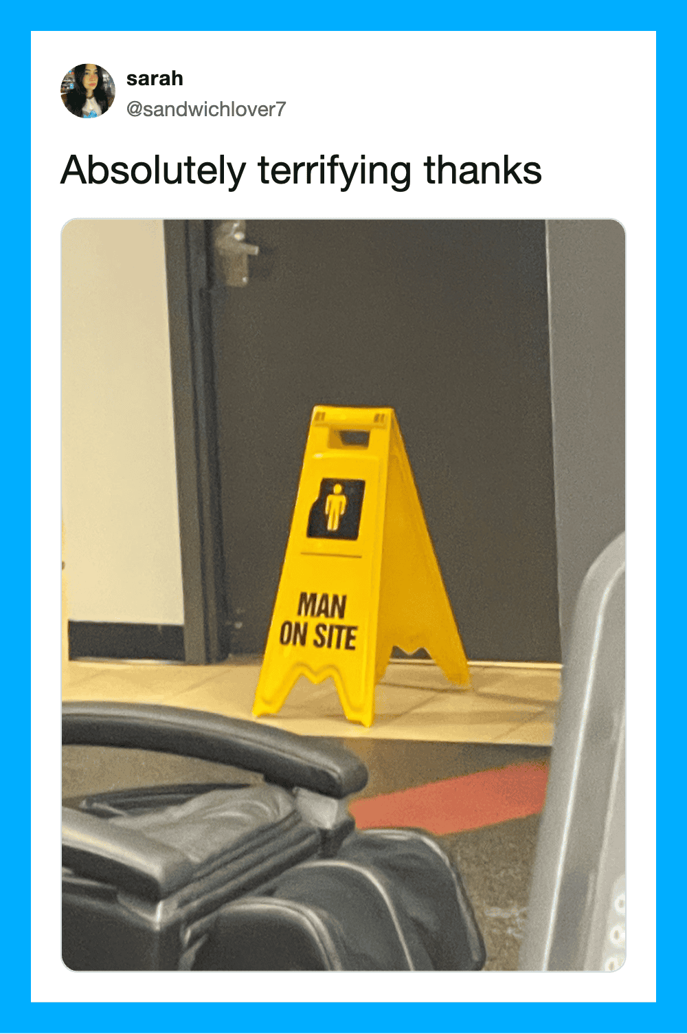 Yellow 'Man On Site' caution sign in front of a door.