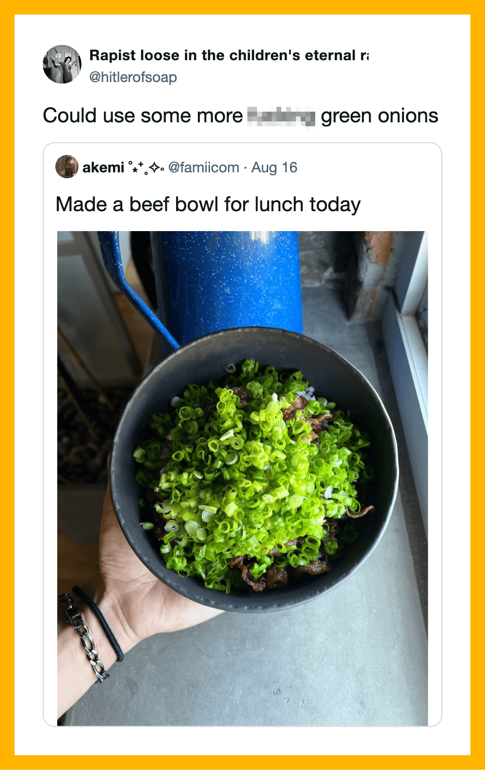 A black bowl filled with chopped green onions, held by a person with a bracelet.