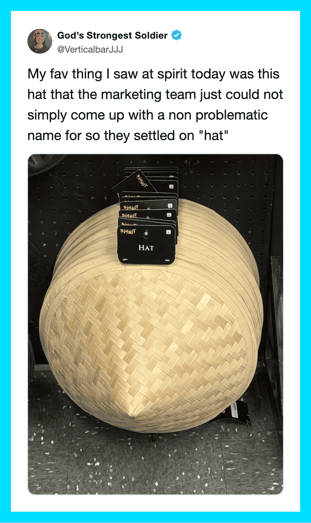 A hat with the word 'HAT' on it, placed on a woven basket.