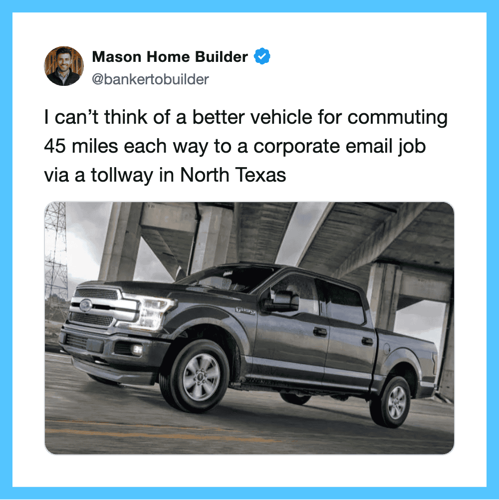 Image of a black pickup truck under a highway overpass.