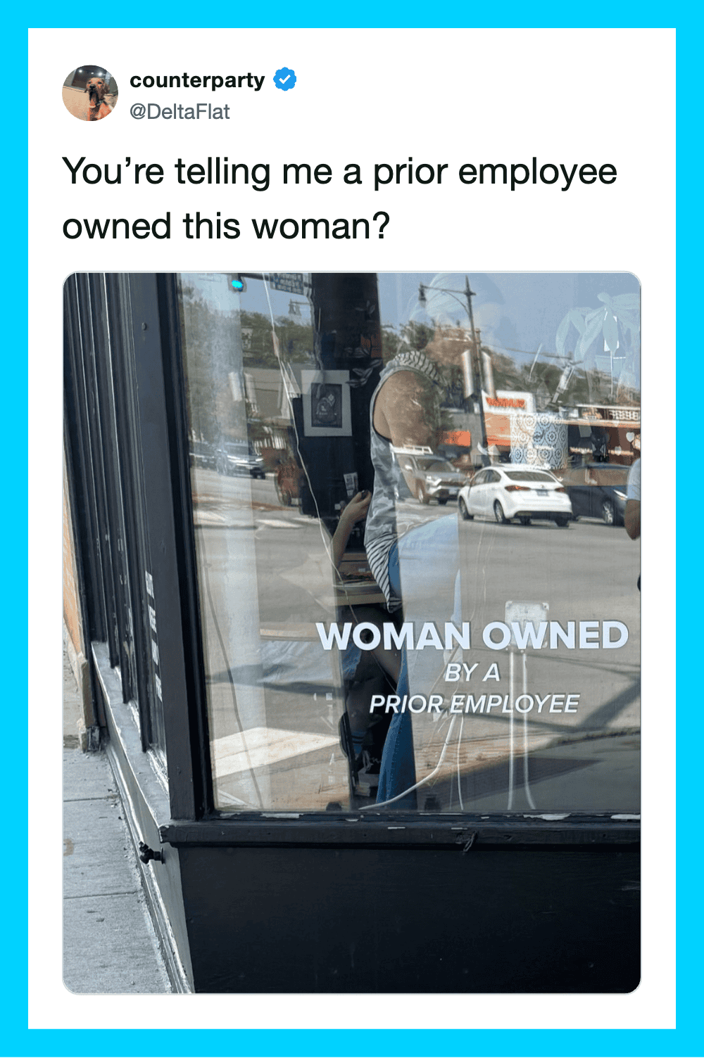 Sign on door says 'WOMAN OWNED BY A PRIOR EMPLOYEE' with a reflection of a woman outside.