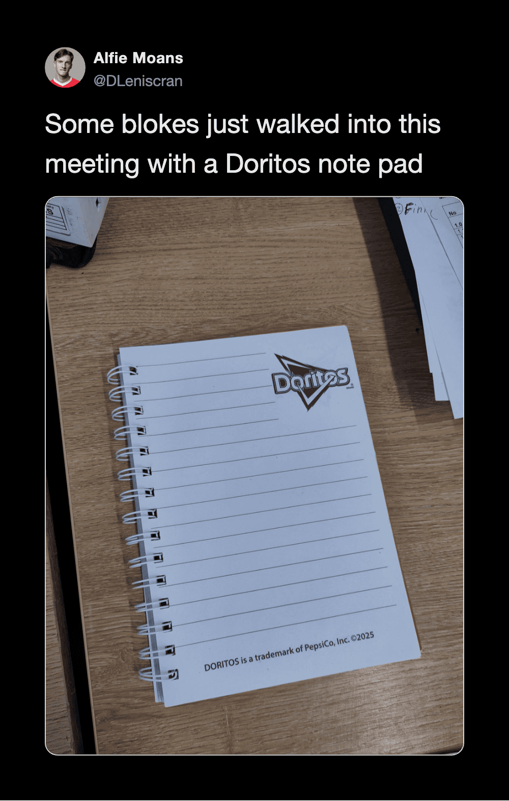 Notepad with Doritos logo used as a note pad on a wooden table.