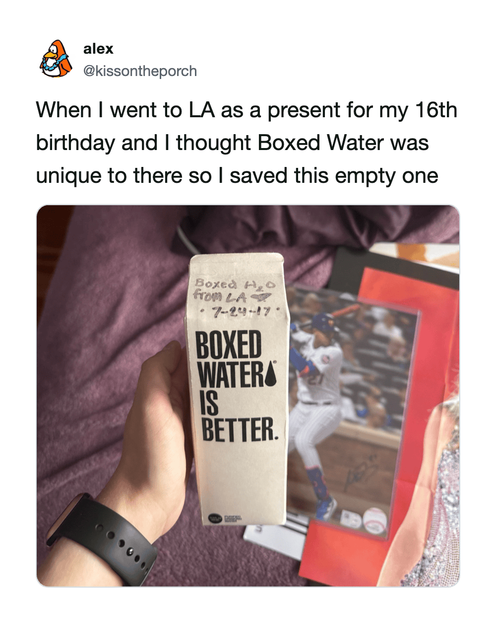 Hand holding a boxed water carton with the text 'Boxed Water is Better'.