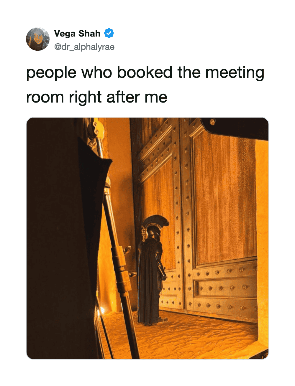 People who booked the meeting room right after me, with a wooden door and a statue.