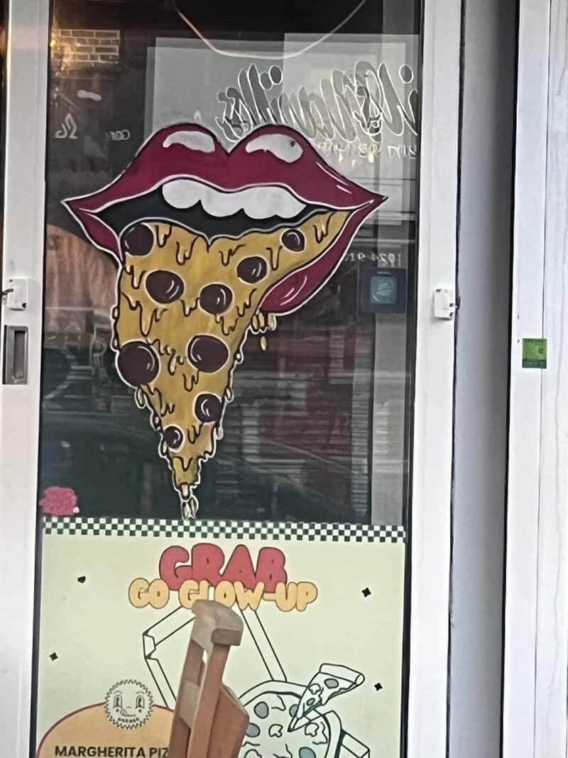 Sign with lips and pizza slice, and a cartoon of a pizza slice with a tongue.